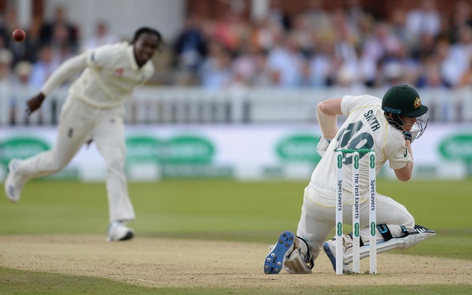 Steve Smith of Australia falls after being struck by a delivery bowled by Jofra Archer during the fourth day of the second Specsavers test match between England and Australia at Lord's  - Philip Brown/Popperfoto via Getty Images