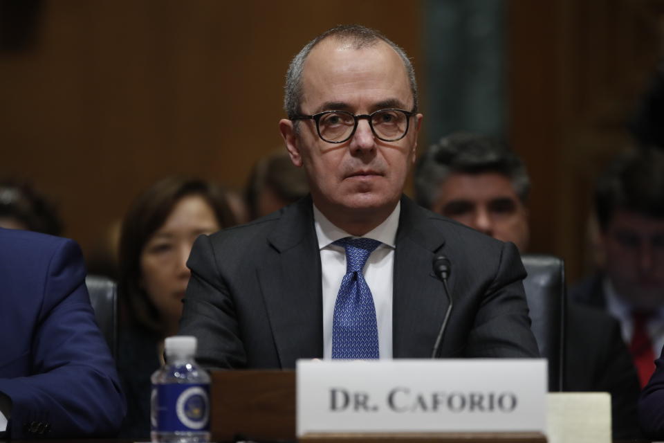 Giovanni Caforio, M.D., Chairman of the Board and Chief Executive Officer Bristol-Myers Squibb Co., prepares to testify before the Senate Finance Committee hearing on drug prices, Tuesday, Feb. 26, 2019 on Capitol Hill in Washington. (AP Photo/Pablo Martinez Monsivais)