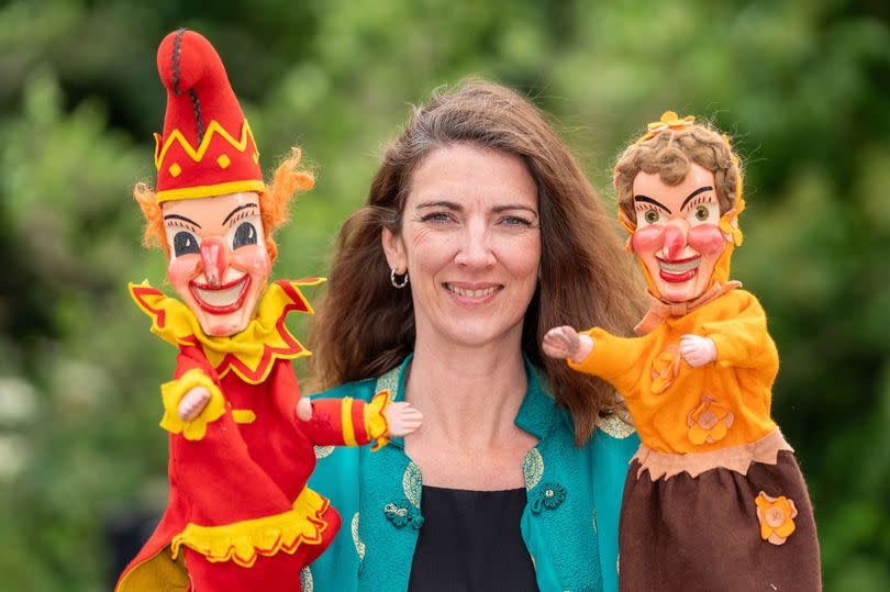 Office Manager Laura Ashcroft with the Victorian Punch and Judy set.