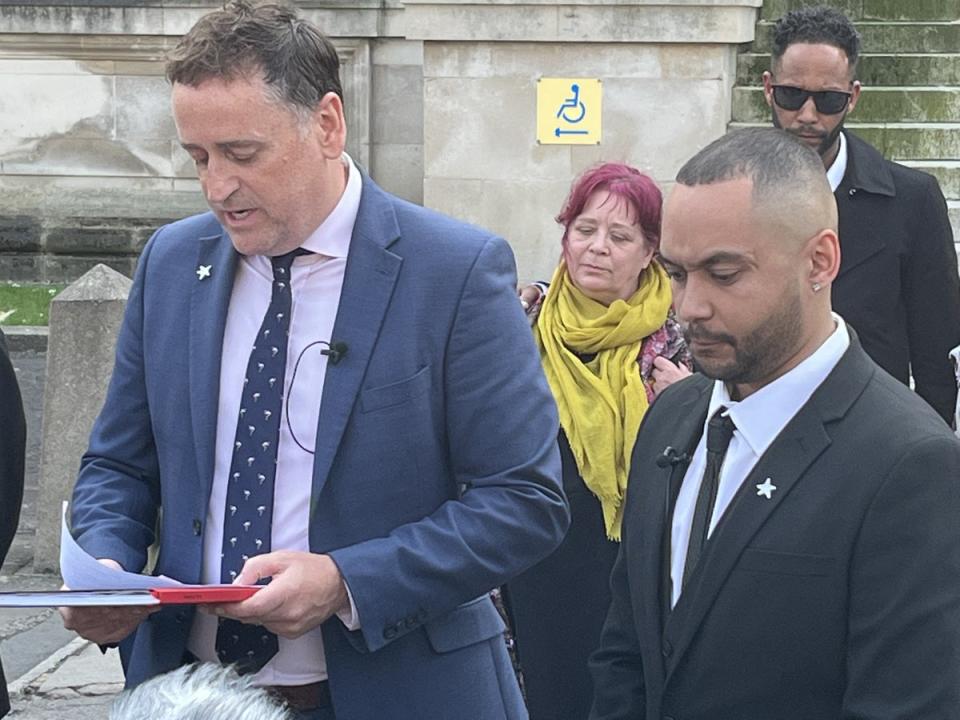 Ben Mwangi (right) listens as Detective Superintendent Darren George of South Wales Police reads a statement after John Cole, Angharad Williamson and a 14-year-old boy were found guilty of murder (Rod Minchin/PA) (PA Wire)