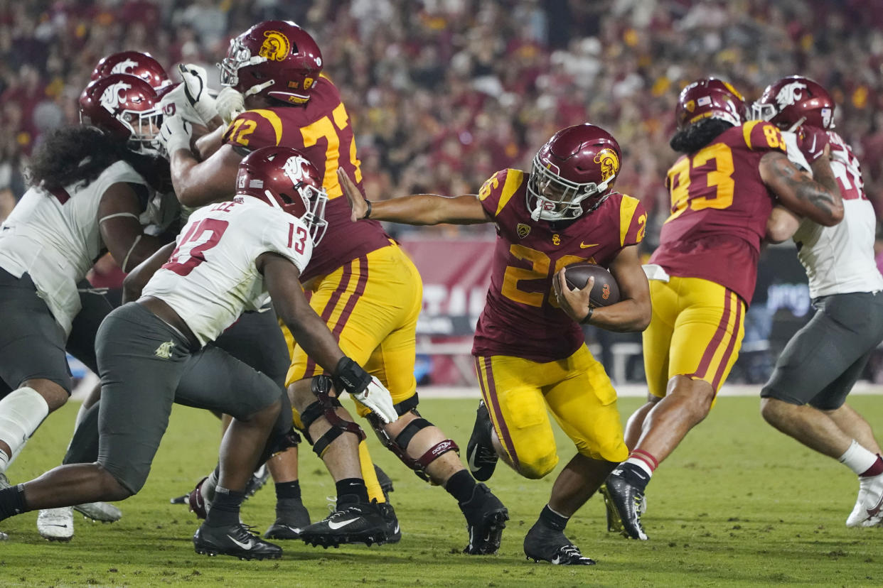 Southern California running back Travis Dye (26) runs against Washington State during the second half of an NCAA college football game Saturday, Oct. 8, 2022, in Los Angeles. (AP Photo/Marcio Jose Sanchez)