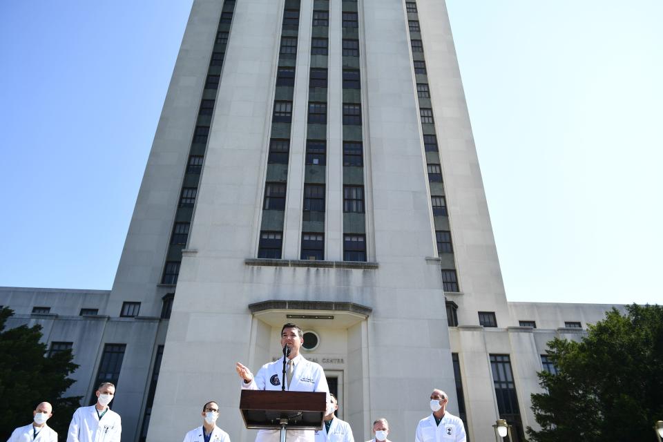 Sean Conley answers questions outside in front of Walter Reed hospital