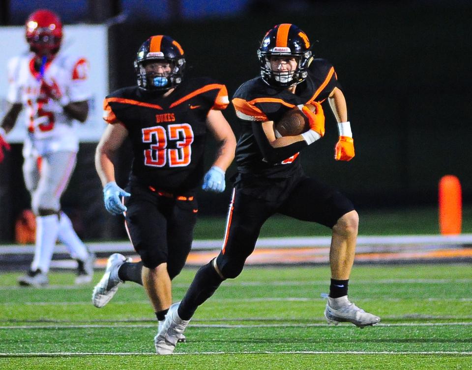 Marlington's Malcum Salyers returns an interception against Youngstown Chaney, Friday Sept. 8, 2023.