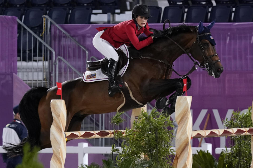 United States' Jessica Springsteen, riding Don Juan van de Donkhoeve, competes during the equestrian jumping individual qualifying at Equestrian Park in Tokyo at the 2020 Summer Olympics, Tuesday, Aug. 3, 2021, in Tokyo, Japan. (AP Photo/Carolyn Kaster)