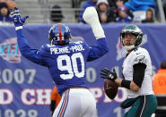 <p>New York Giants defensive end Jason Pierre-Paul (90) defends against Philadelphia Eagles quarterback Nick Foles (9) during the first half at MetLife Stadium. Mandatory Credit: Robert Deutsch-USA TODAY Sports </p>