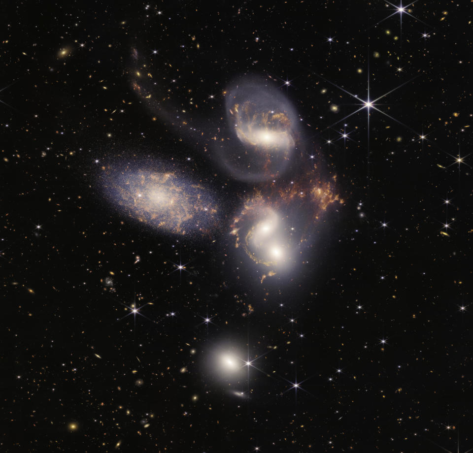 IN SPACE - JULY 12: In this handout photo provided by NASA, NASA's James Webb Space Telescope reveals Stephans Quintet, a visual grouping of five galaxies, in a new light on July 12, 2022 in space. This enormous mosaic is Webb's largest image to date, covering regarding one-fifth of the Moons diameter. It contains over 150 million pixels and is constructed from almost 1,000 separate image files. The information from Webb provides new insights into how galactic interactions may have driven galaxy evolution in the early universe.  (Photo by NASA, ESA, CSA, and STScI via Getty Images)