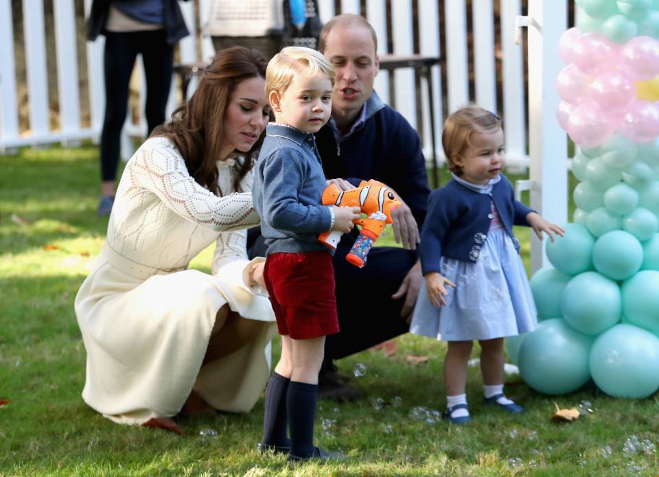 <p>Not to be outdone by his sister, George wore a blue shirt, red shorts and his signature knee-high socks. [Photo: Getty/Chris Jackson] </p>