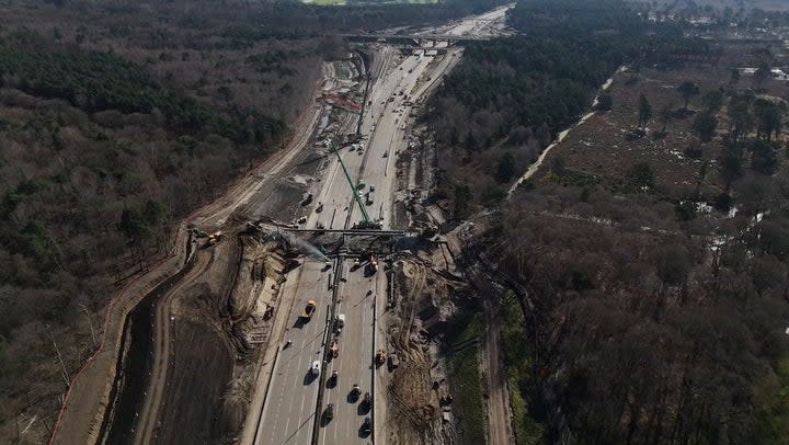 Watch: M25 drone footage shows workers demolishing bridge as motorway remains closed. (PA)