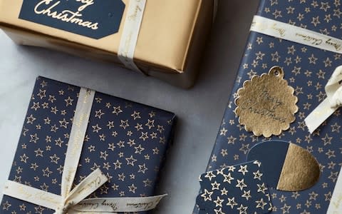 Cox & Cox Reversible Gold and Star Wrapping Paper - Credit: Cox &amp; Cox