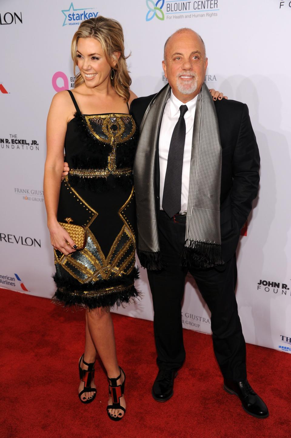 Billy Joel and his wife, Alexis, attend the Elton John AIDS Foundation's 12th Annual an Enduring Vision Benefit at Cipriani Wall Street on Oct. 15, 2013, in New York.