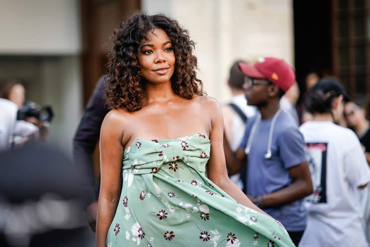 Gabrielle Union was spotted in Paris with glowing skin and voluminous curls. (Photo: Getty Images)