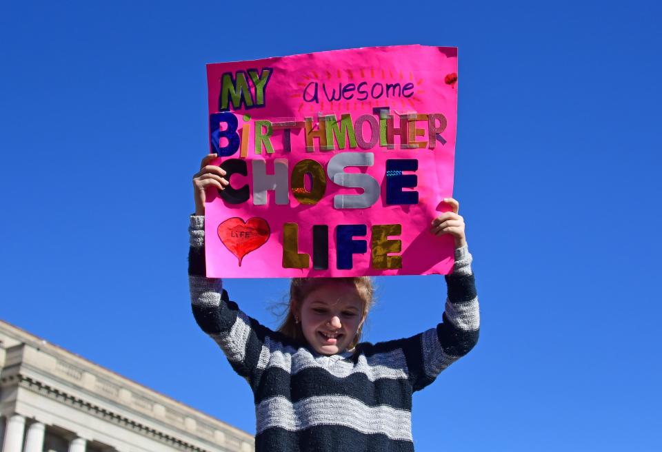 <p>A girl holds up a sign as anti-abortion activists from around the U.S. gather in Washington, Jan. 19, 2017 for the annual March for Life. (Photo: Eva Hambach/AFP/Getty Images) </p>