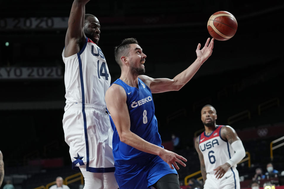 Czech Republic's Tomas Satoransky (8) drives to the basket against United States's Draymond Green (14) during a men's basketball preliminary round game at the 2020 Summer Olympics, Saturday, July 31, 2021, in Saitama, Japan. (AP Photo/Eric Gay)