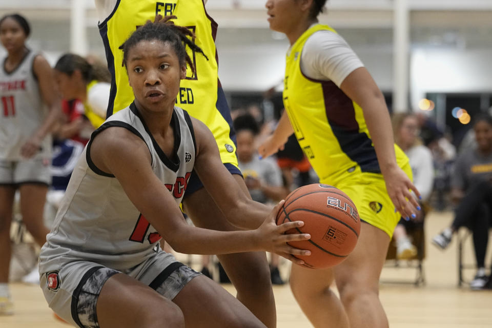 Iowa Attack guard Divine Bourrage pulls in a rebound during their game against FBC United at the NCAA College Basketball Academy, Friday, July 28, 2023, in Memphis, Tenn. (AP Photo/George Walker IV)