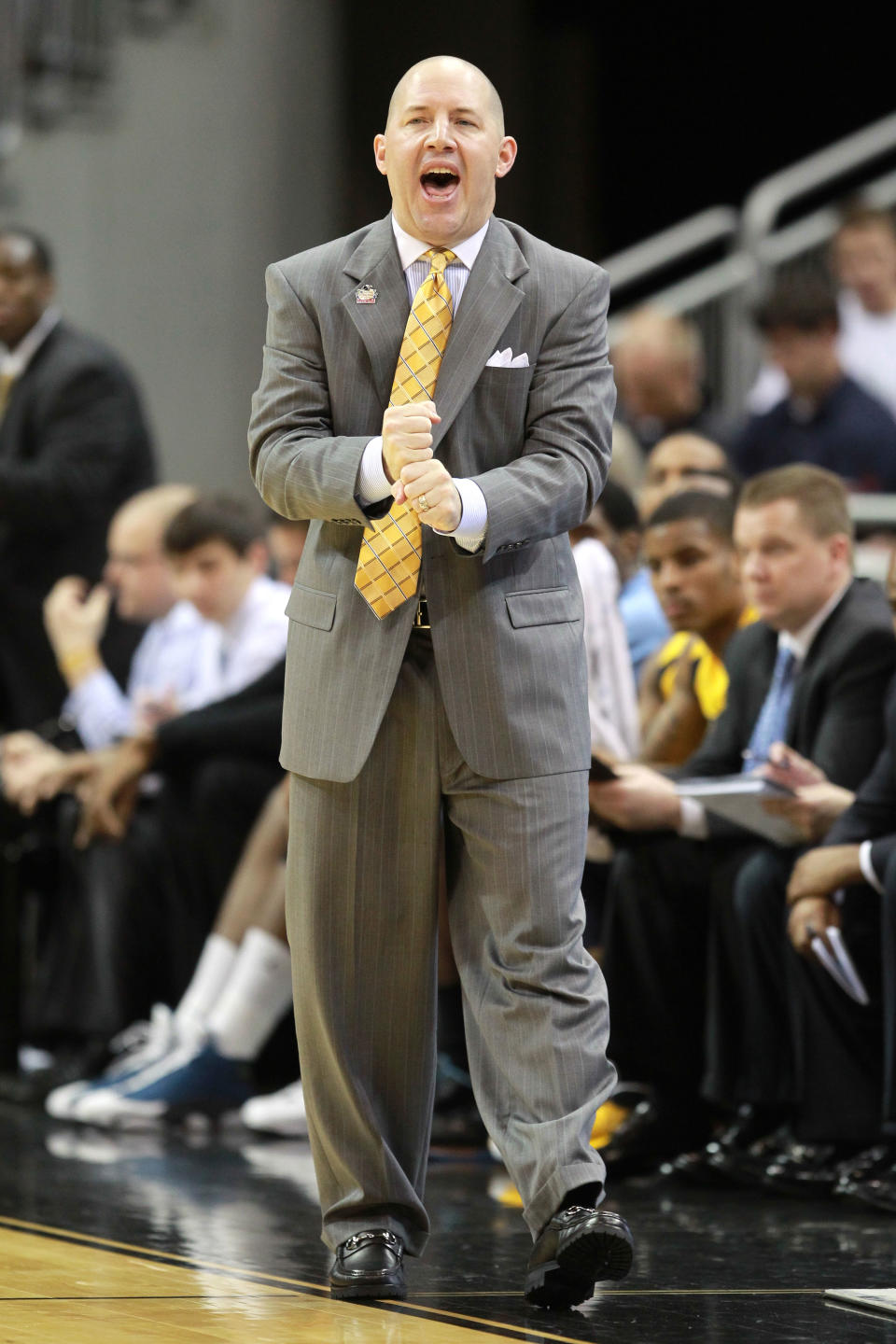 LOUISVILLE, KY - MARCH 15: Head coach Buzz Williams of the Marquette Golden Eagles shouts from the sidelines against the Brigham Young Cougars during the second round of the 2012 NCAA Men's Basketball Tournament at KFC YUM! Center on March 15, 2012 in Louisville, Kentucky. (Photo by Andy Lyons/Getty Images)