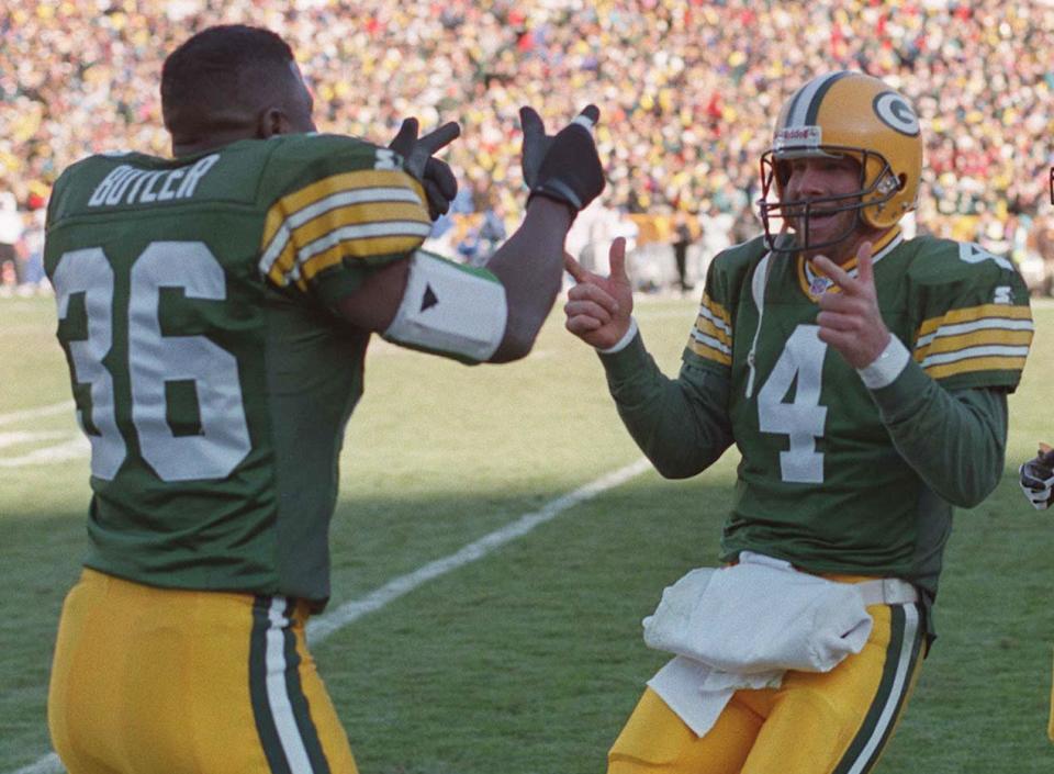 Packers quarterback Brett Farve celebrates with LeRoy Butler after his fourth touchdown pass during their 28-18 win over the Detroit Lions, Nov. 3, 2006 at Lambeau Field in Green Bay.