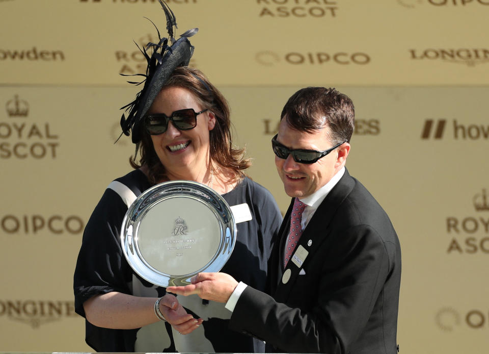 Horse Racing - Royal Ascot - Ascot Racecourse, Ascot, Britain - June 24, 2023 Aidan O'Brien celebrate winning the Royal Ascot champion trainer trophy with his wife Anne-Marie REUTERS/Andrew Boyers