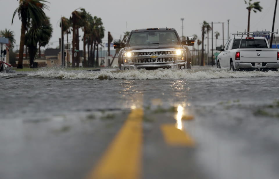 <p>A drives moves through flood waters left behind by Hurricane Harvey, Saturday, Aug. 26, 2017, in Aransas Pass, Texas. (Photo: Eric Gay/AP) </p>