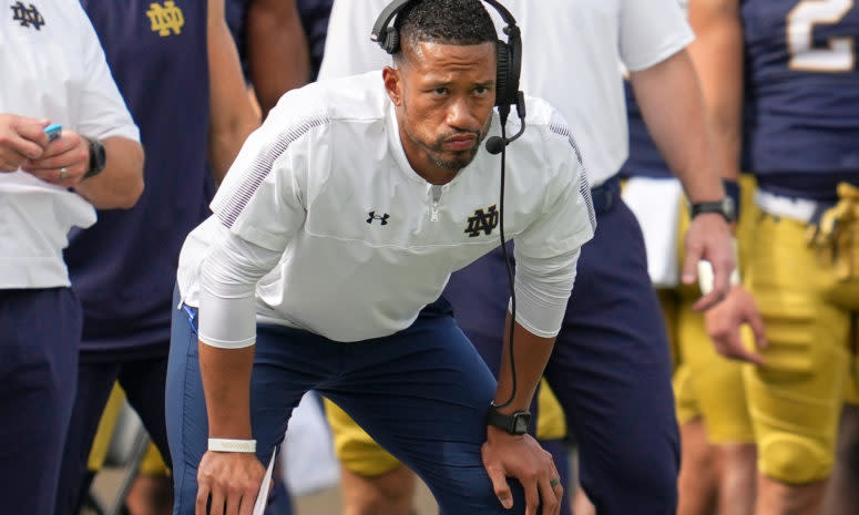 Marcus Freeman watches from the sideline.