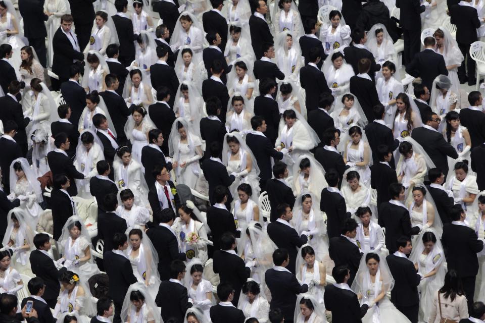 Thousands of couples take part in a mass wedding ceremony at Cheongshim Peace World Center on February 17, 2013 in Gapyeong-gun, South Korea.