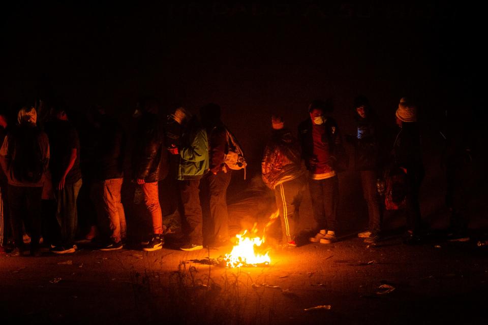 Hundreds of migrants on the bank of the Rio Grande await to be processed by Customs and Border Protection officer in El Paso, Texas.