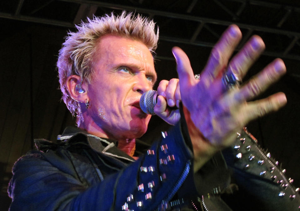 Billy Idol performs Friday, Oct. 26, 2012, in Seattle. Idol came to play in Seattle after Michael Henrichsen launched a two-year grass-roots campaign to convince the rock star to play for his birthday party. (AP Photo/Gene Johnson)