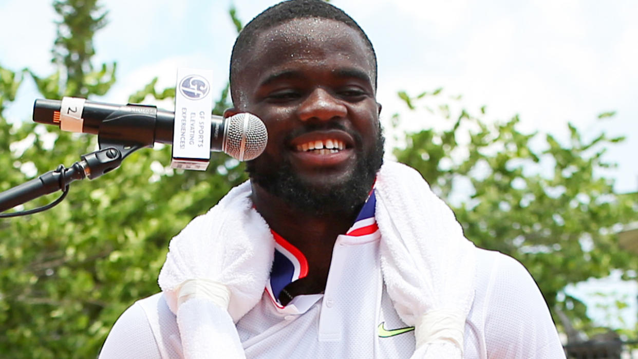 Frances Tiafoe is pictured speaking to broadcasters after playing at the All-American Team Cup.