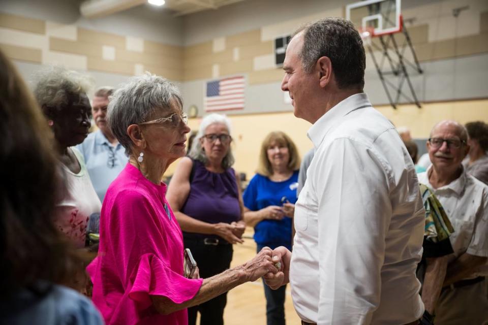 Jo Souvignier, of Carmichael, left, voices her appreciation for U.S. Rep. Adam Schiff after a town hall event hosted by the Women Democrats of Sacramento County on Friday, Aug. 4, 2023, at the Oak Park Community Center in Sacramento. Former California Assemblyman and Sacramento City Council candidate Roger Dickinson introduced Schiff, who is campaigning to fill Sen. Dianne Feinstein’s current position.