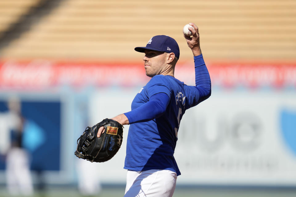 Los Angeles Dodgers' Freddie Freeman warms up before Game 1 of baseball's NL Division Series against the San Diego Padres, Saturday, Oct. 5, 2024, in Los Angeles. (AP Photo/Ashley Landis)