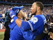 Toronto Blue Jays designated hitter Edwin Encarnacion (10) celebrates with Toronto Blue Jays starting pitcher Marcus Stroman (6) after beating the Baltimore Orioles in the American League wild card playoff baseball game at Rogers Centre. Mandatory Credit: Nick Turchiaro-USA TODAY Sports