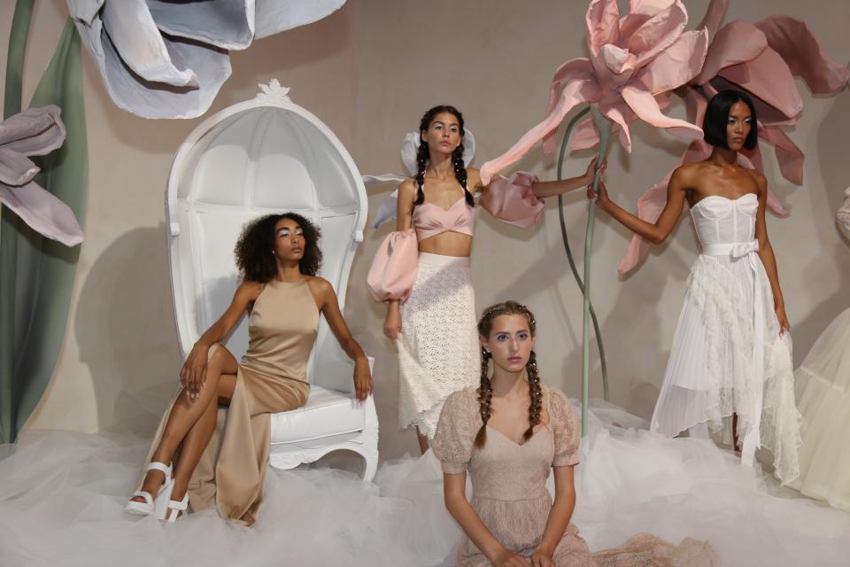 Fashion from Alice + Olivia is modeled at a presentation during Fashion Week in New York on Monday, Sept. 9, 2019. (AP Photo/Ragan Clark)