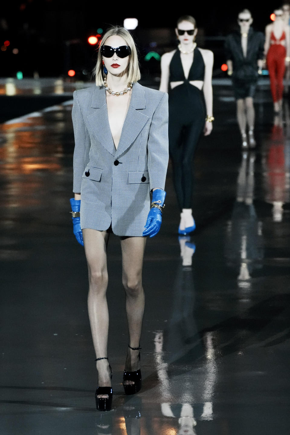 A model wears a creation for Saint Laurent Spring-Summer 2022 ready-to-wear fashion show presented Tuesday, Sept. 28, 2021, in Paris. (AP Photo/Thibault Camus)