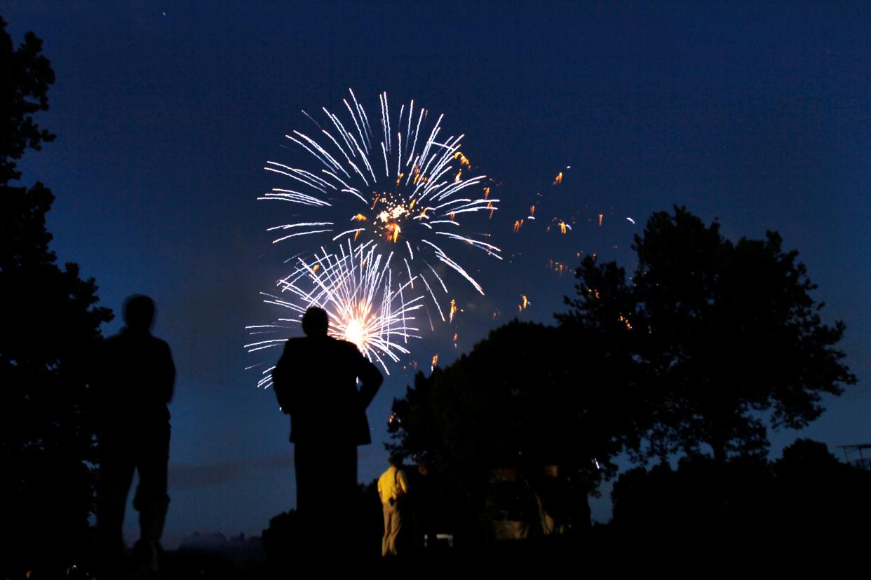 Jerry Stahl, center under the fireworks, co-chairman of the Wegmans LPGA Championship, watches the fireworks on 18 during the final round of the Wegmans LPGA Championship