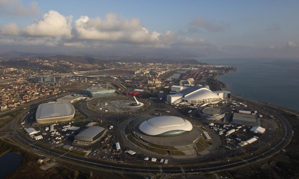 An aerial view from a helicopter shows the Olympic Park under construction in the Adler district of the Black Sea resort city of Sochi