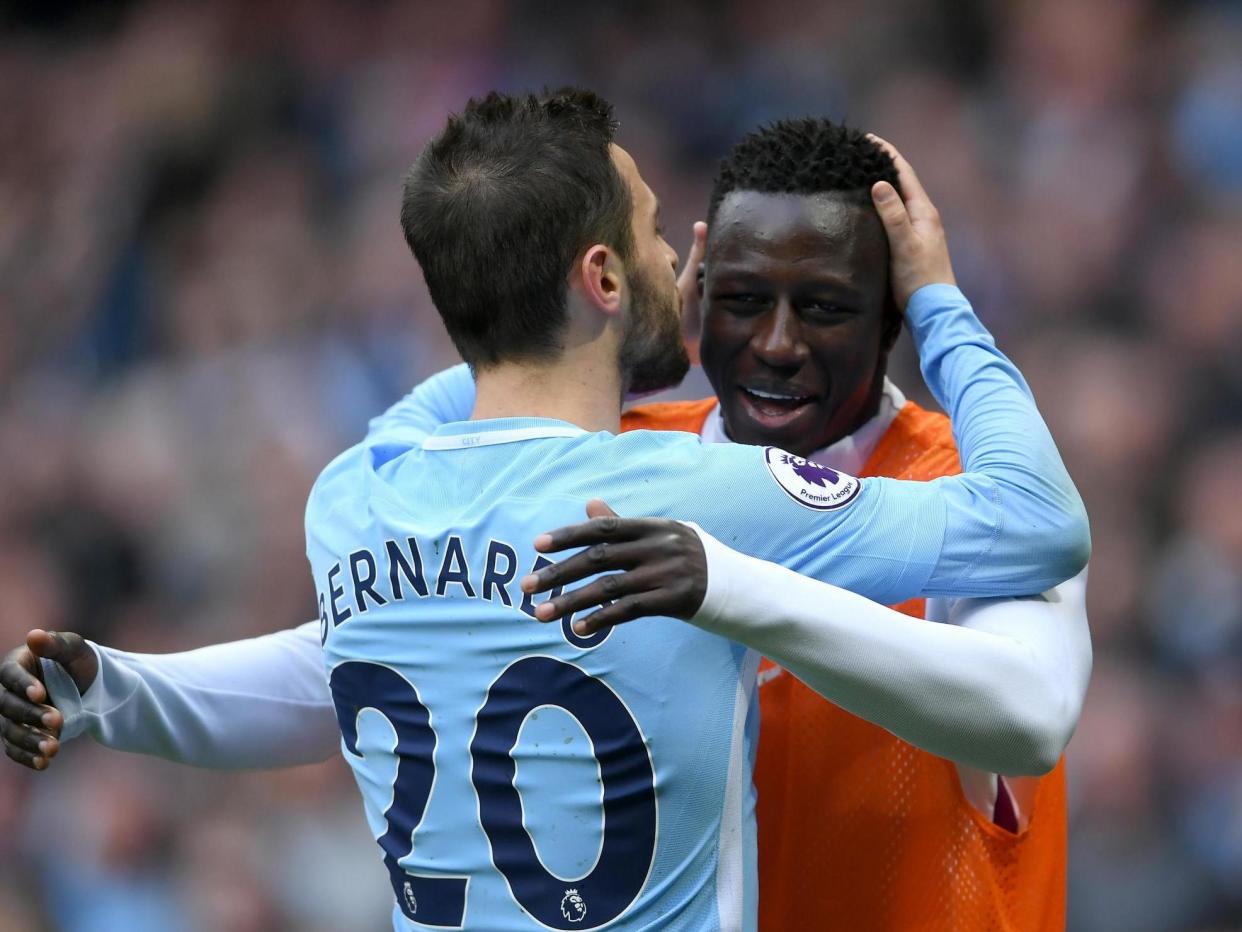 Manchester City's Bernardo Silva and Benjamin Mendy: Getty Images