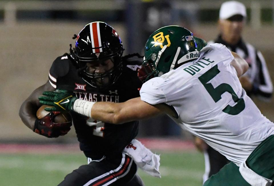 Texas Tech running back SaRodorick Thompson, left, has 36 rushing touchdowns, tied with Ricky Williams for fourth place on the Tech career list and one behind Bam Morris.