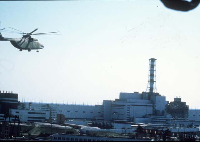 A helicopter flies over the Chernobyl nuclear power plant in Ukraine after the 1986 disaster (PA Archive)