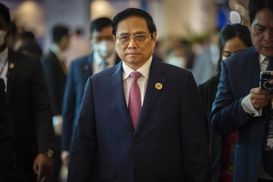 Vietnam's Prime Minister Pham Minh Chinh, middle, arrives for the ASEAN summit in Phnom Penh, Cambodia, Friday, Nov. 11, 2022. 2022. The ASEAN summit kicks off a series of three top-level meetings in Asia, with the Group of 20 summit in Bali to follow and then the Asia Pacific Economic Cooperation forum in Bangkok. (AP Photo/Anupam Nath)