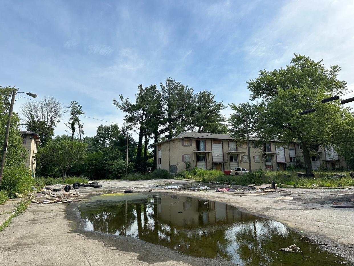 Courtyards by Roselawn Park sits vacant, surrounded by scattered trash and old tires on June 25, 2024.