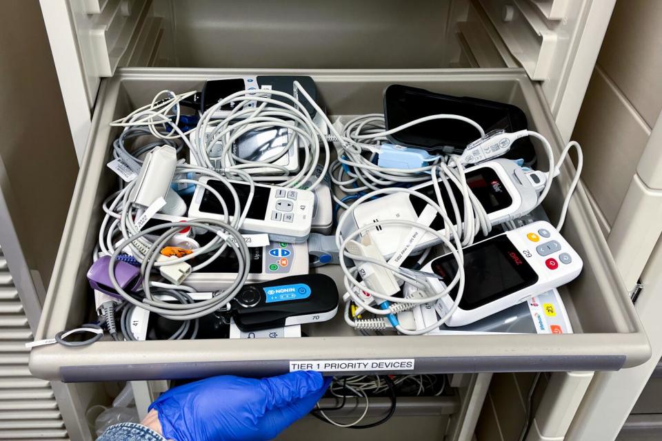 A drawer full of pulse oximeters.