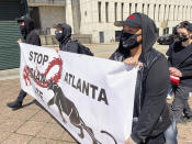 Camden Hunt poses for a picture at a rally on Saturday, March 20, 2021, across from the Georgia state Capitol in Atlanta to demand justice for the victims of shootings at massage businesses days earlier. A 21-year-old white man is accused of killing eight people, six of them women of Asian descent, at three Atlanta-area massage businesses Tuesday. Hunt said she came out to the rally Saturday to “show Black and Asian solidarity.” (AP Photo/Kate Brumback)