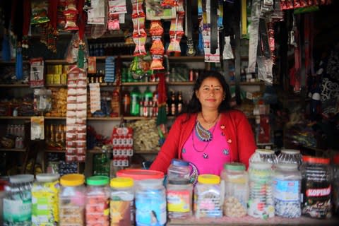 Renuka Gautam, 40, at her store in Solambu village, Chauri Deurali Rural Municipality, Kavrepalanchok District, Nepal - Credit: Bikram Rai&nbsp;