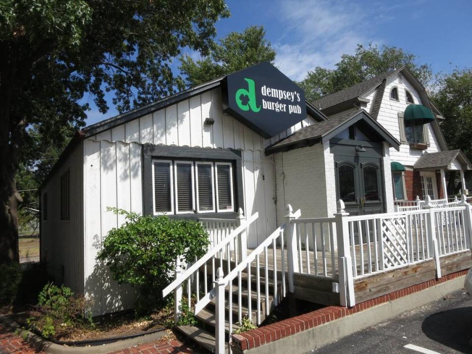 The cottage-shaped restaurant building at the back of Clifton Square struggled to keep a tenant until 2014, when Dempsey’s Burger Pub took it over.