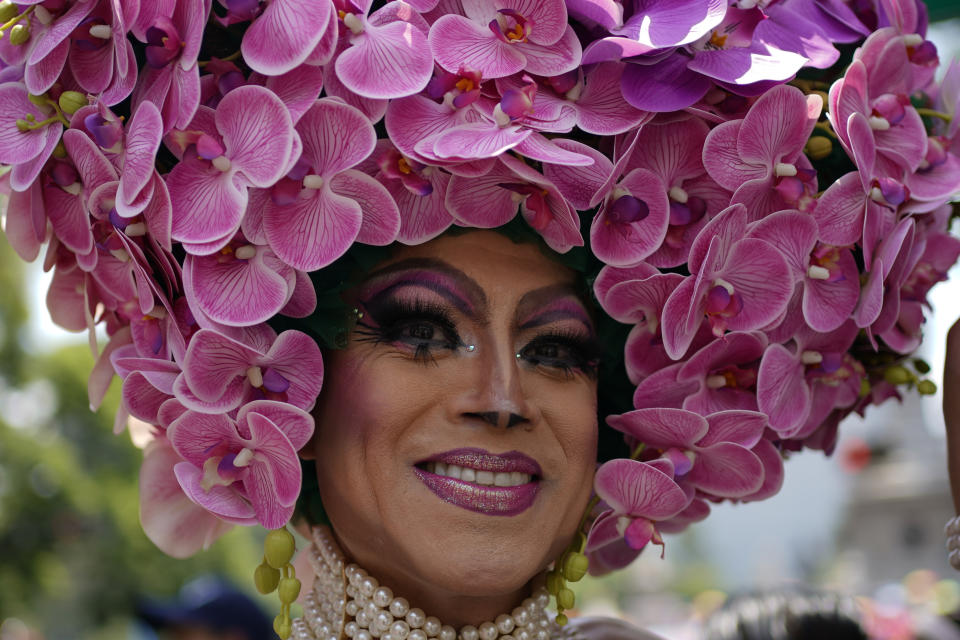 A participant smiles during the annual Pride parade, marking the culmination of LGBTQ+ Pride month, in Mexico City, Saturday, June 29, 2024. (AP Photo/Aurea Del Rosario)