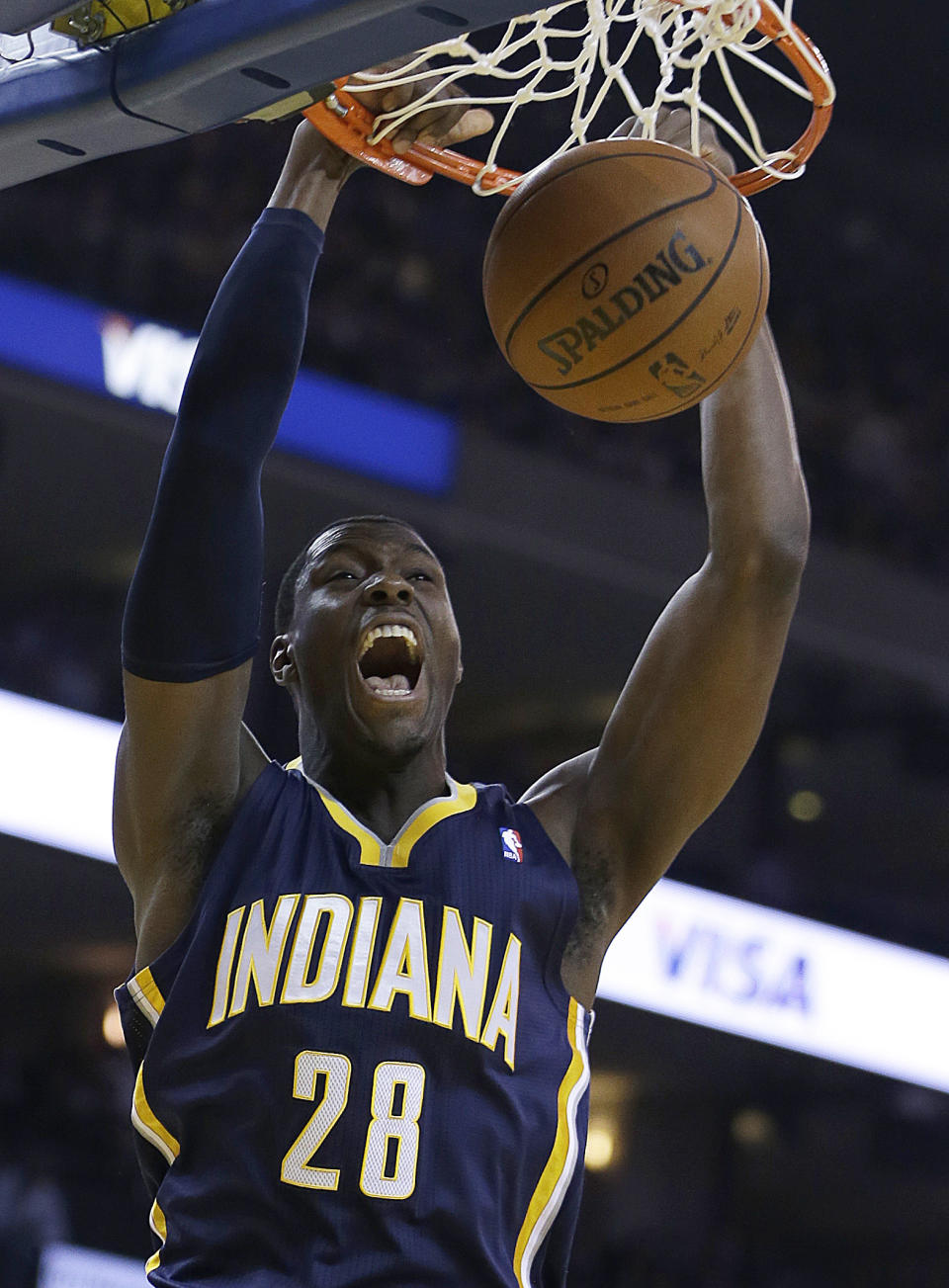 Indiana Pacers' Ian Mahinmi scores against the Golden State Warriors during the first half of an NBA basketball game, Monday, Jan. 20, 2014, in Oakland, Calif. (AP Photo/Ben Margot)