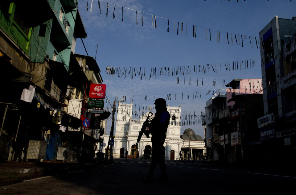 FILE - In this Wednesday, April 24, 2019 file photo, a security officer stands guard outside St. Anthony's Shrine where bombing was carried out on Easter Sunday, in Colombo, Sri Lanka. Roughly 250 people died in six coordinated suicide bombings that ripped through Sri Lanka on Easter Sunday. (AP Photo/Gemunu Amarasinghe, File)