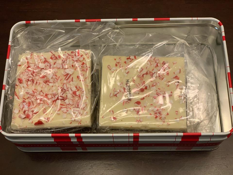 trader joes peppermint bark in tin wrapped in individual plastic portions