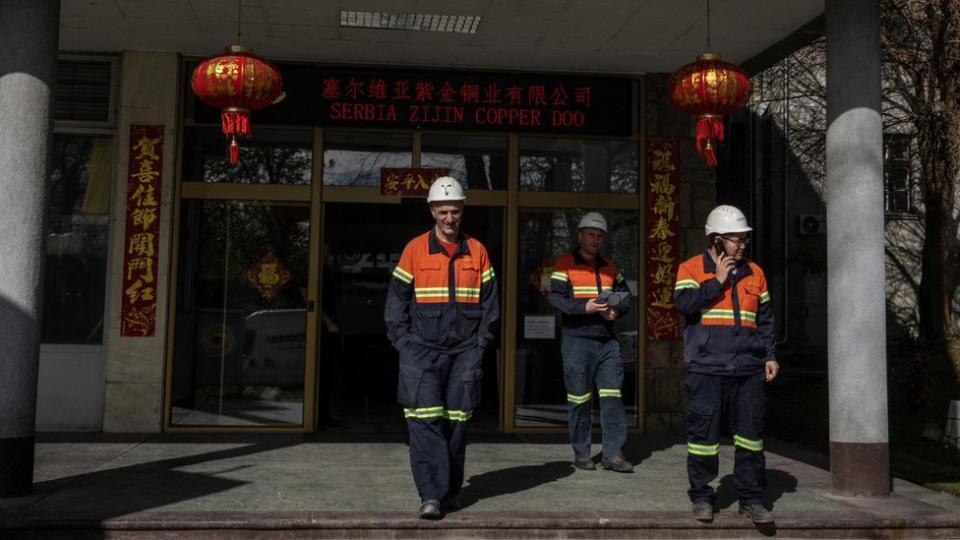 Employees walk out of Serbia Zijin Copper DOO in the mining town of Bor, Serbia, April 5, 2024.