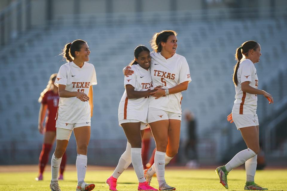 Texas players Trinity Byars and Abby Allen, center, celebrate a 1-0 win in the Big 12 Tournament semifinals at Myers Stadium last November. The Longhorns will open the season ranked No. 17 nationally.