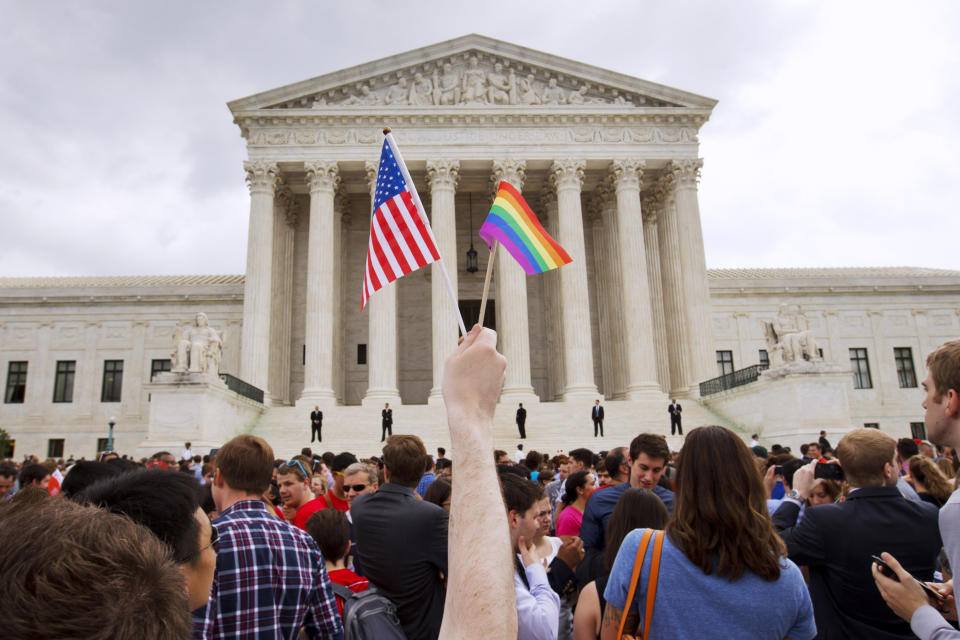 FILE - A crowd celebrates outside of the Supreme Court in Washington after the court declared that same-sex couples have a right to marry anywhere in the U.S., on Friday, June 26, 2015. (AP Photo/Jacquelyn Martin, File)